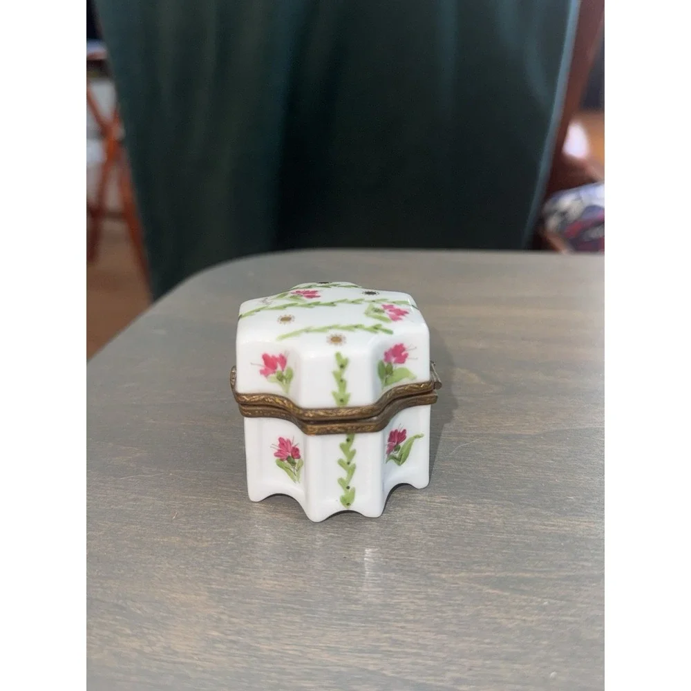 Beautiful authentic vintage French Limoges porcelain footed trinket box.